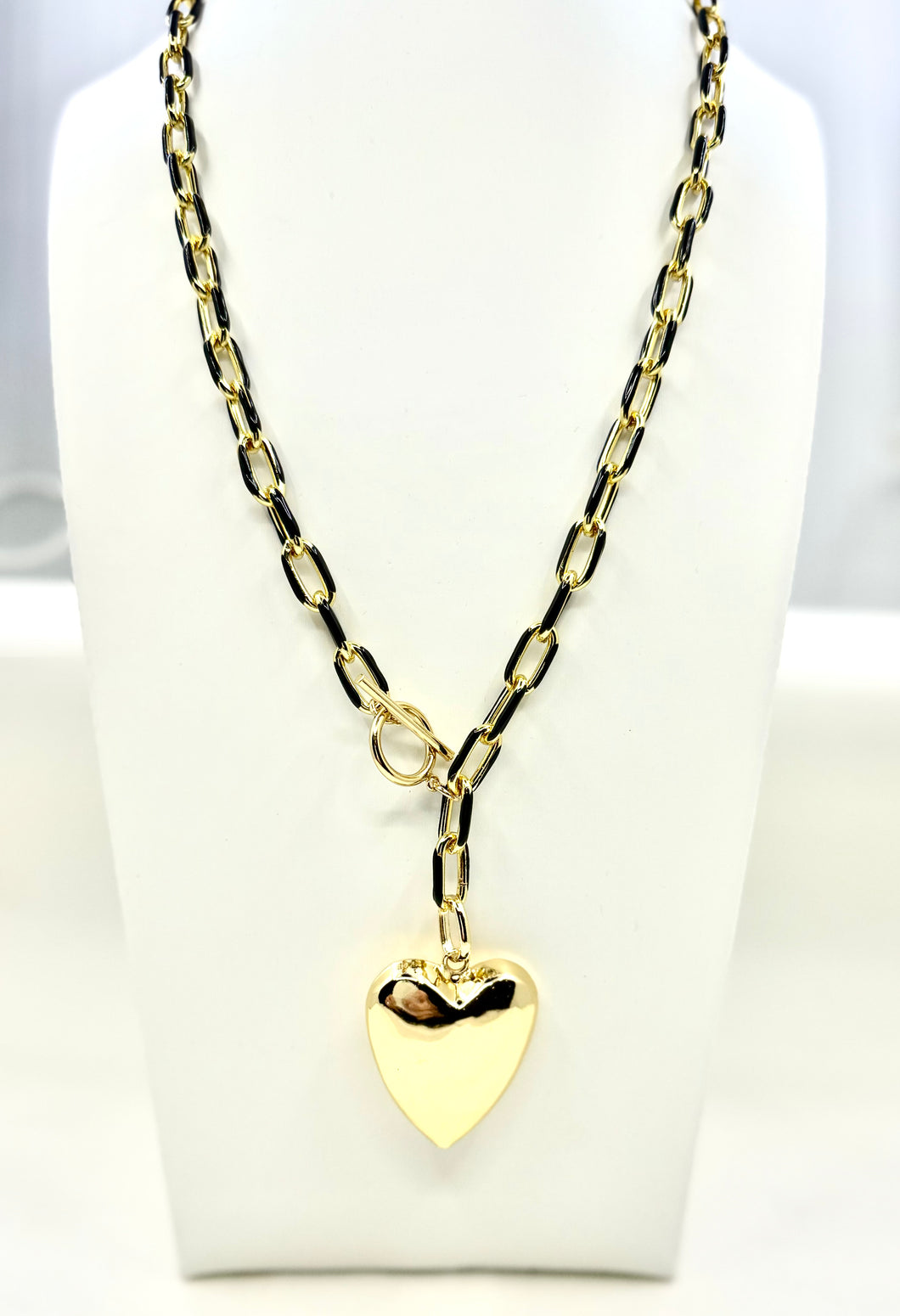 Puffed heart on enamel and gold chain