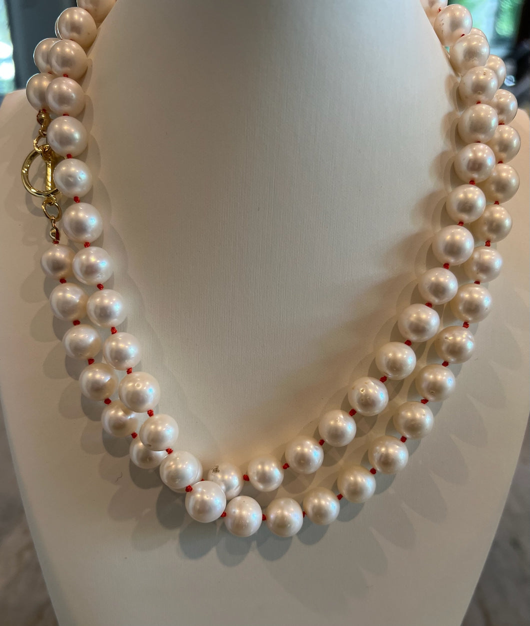Orange knotted pearl necklace